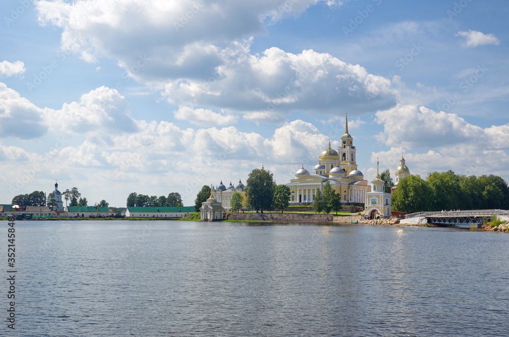 The monastery of the Nilo-Stolobenskaya desert and the Seliger lake on a Sunny summer day. Tver region, Russia