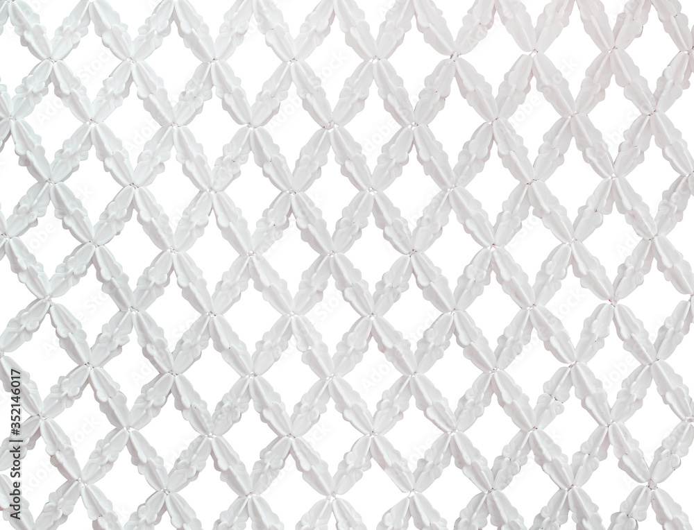 Artificial white crown flower mesh in seamless embroidery patterns isolated on background Artificial white crown flower mesh in seamless embroidery patterns isolated on background