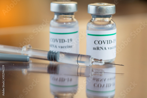 COVID-19 mRNA Vaccine and syringe with needle injection. It use for prevention, immunization and treatment from corona virus infection (novel coronavirus disease 2019,COVID-19, nCoV 2019). 