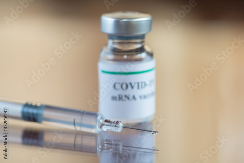COVID-19 mRNA Vaccine and syringe with needle injection. It use for prevention, immunization and treatment from corona virus infection (novel coronavirus disease 2019,COVID-19, nCoV 2019). 