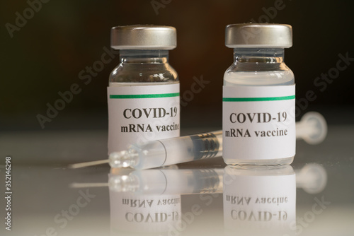 COVID-19 mRNA Vaccine and syringe with needle injection. It use for prevention, immunization and treatment from corona virus infection (novel coronavirus disease 2019,COVID-19, nCoV 2019). 
