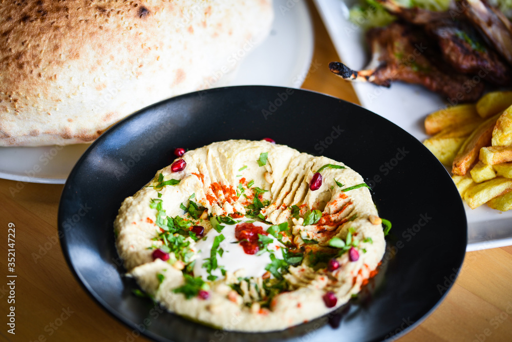 delicious home made lebanese hummus with fresh pomegranate seeds delicious home made lebanese hummus with fresh pomegranate seeds