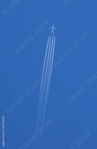 Boeing 747 in flight on blue sky background