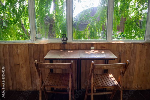 Tables and chairs with an atmosphere in a coffee shop in Thailand.