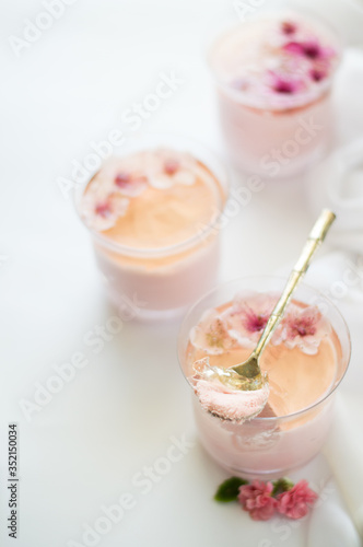 Pink mousse with peach blossom flower on the top