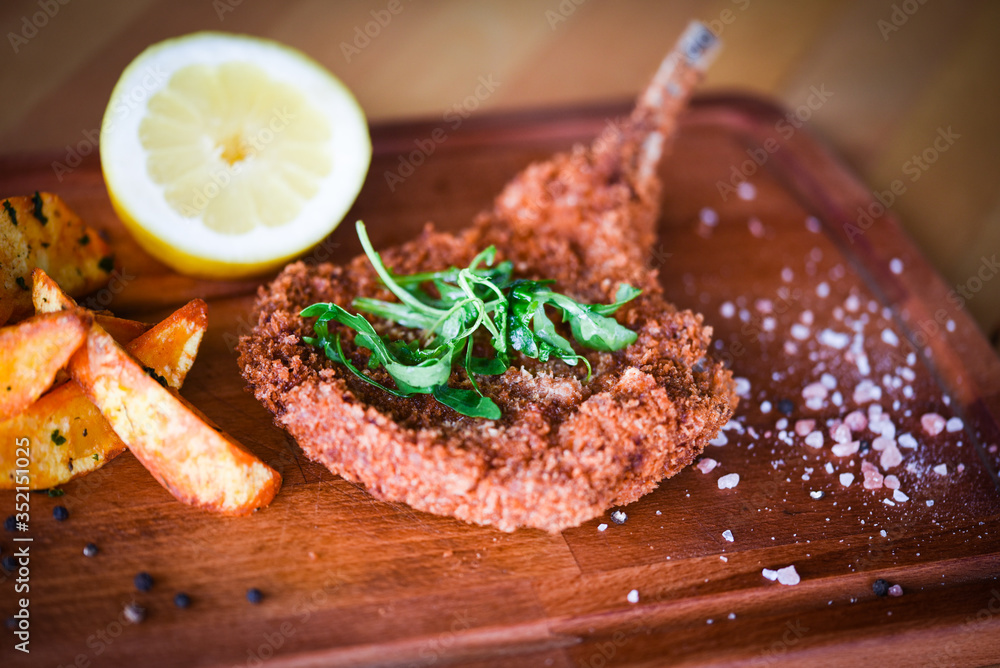 delicious crispy panko pork schnitzel with wedges & fresh pepper delicious crispy panko pork schnitzel with wedges & fresh pepper