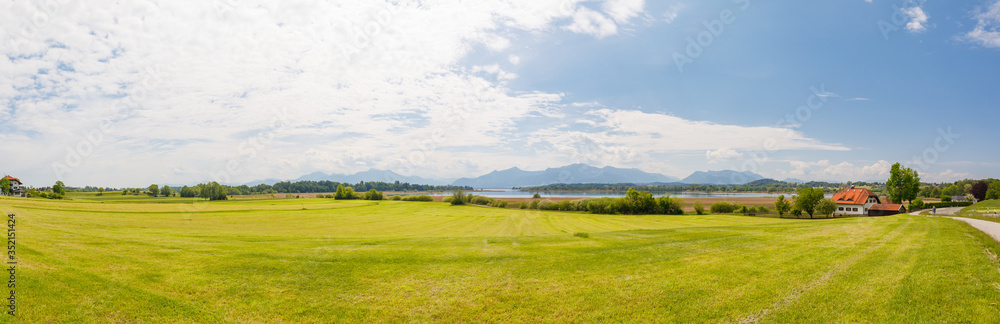 Fototapeta premium Panorama of lake Chiemsee with alps in background