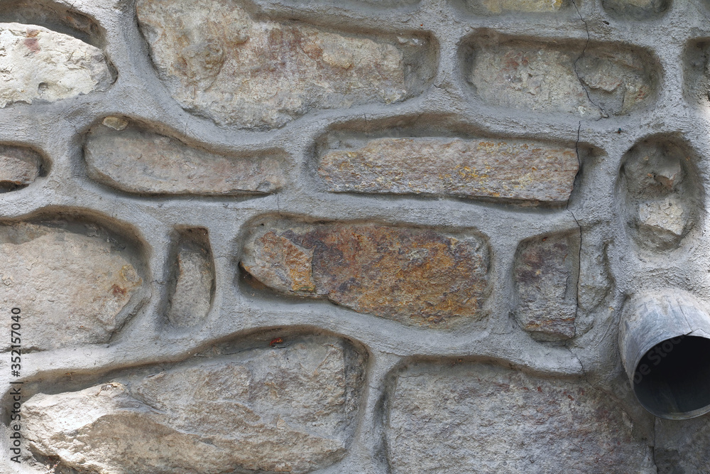 stone wall background with cement lining seams stone wall background with cement lining seams