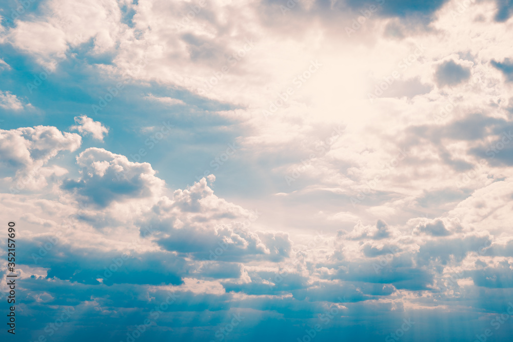 Fototapeta premium Dramatic view of the sky with clouds and the sun
