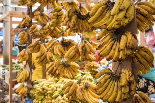 Fruit stall of banana on the weekly farmers market in the capital of the Toba Batak on Samosir Island, Pangururan, within Lake Toba in the northern part of Sumatra photo