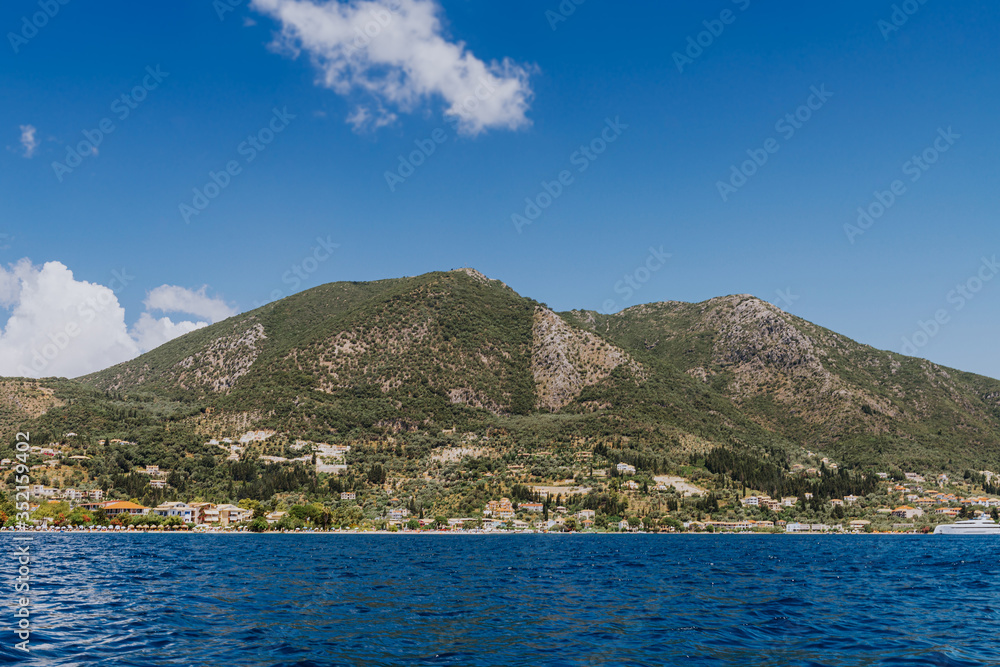 Greek Island viewed from the sea. Beautiful sea landscapes on Island in Greece. In distance is famous Scorpios island, from the left side is Lefkada island and from right is a part of gorgeous