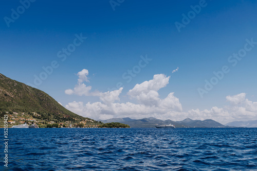 Greek Island viewed from the sea. Beautiful sea landscapes on Island in Greece. In distance is famous Scorpios island, from the left side is Lefkada island and from right is a part of gorgeous © andreiko