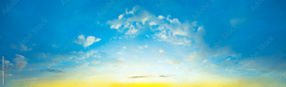 Fototapeta premium Dawn sky. Beautiful landscape with clouds and orange sun on sky