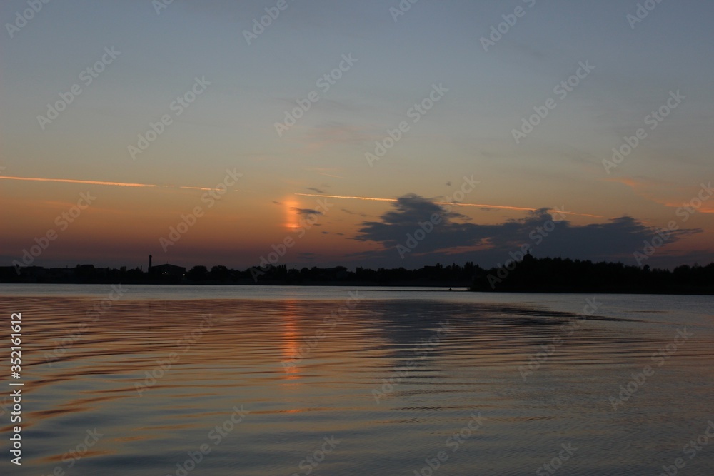 Orange beautiful sunset over the Volga river in Astrakhan. Orange beautiful sunset over the Volga river in Astrakhan.
