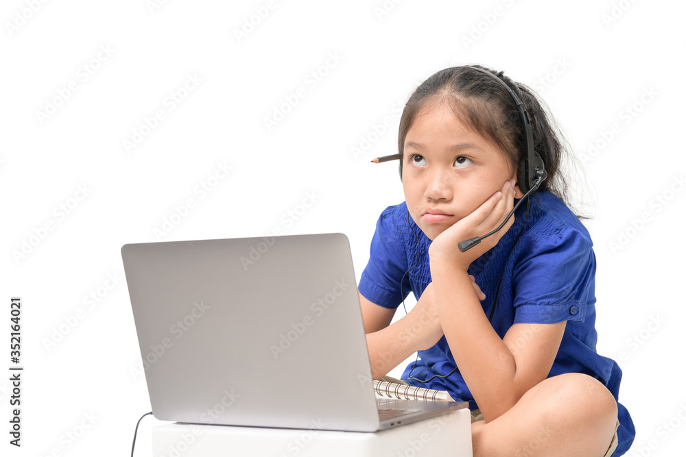 Asian girl student wear headphone thinkinf and study online isolated Asian girl student wear headphone thinkinf and study online isolated