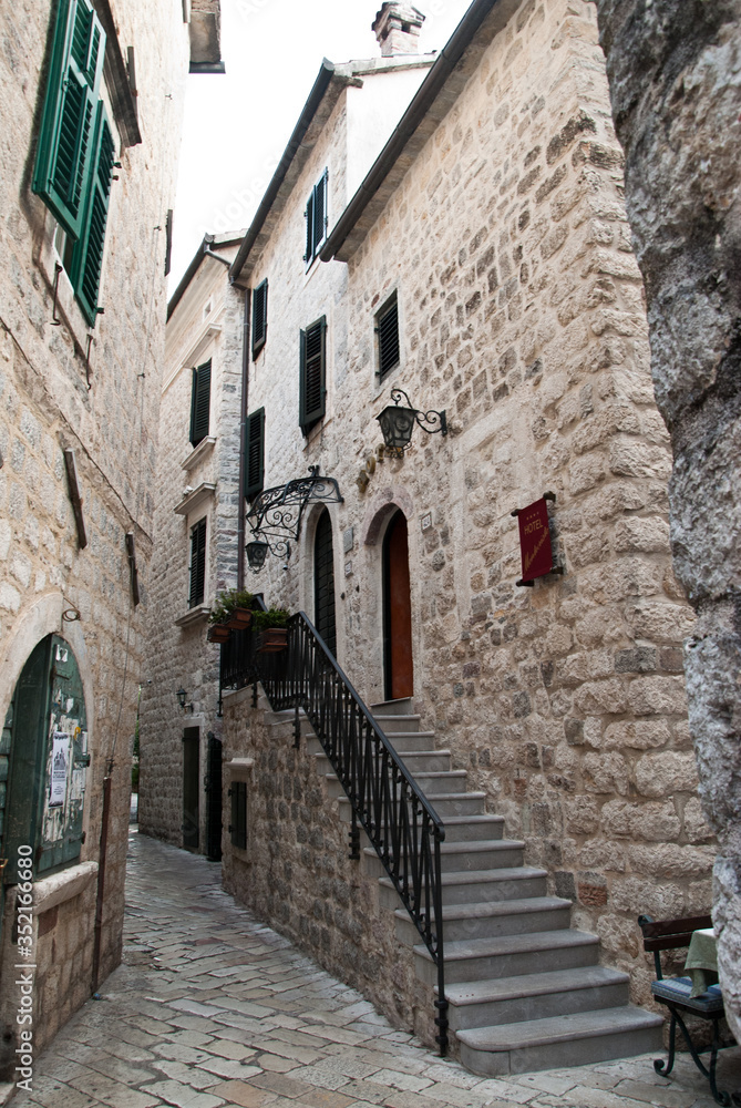 A narrow alley in the old town of sun-drenched A narrow alley in the old town of sun-drenched
