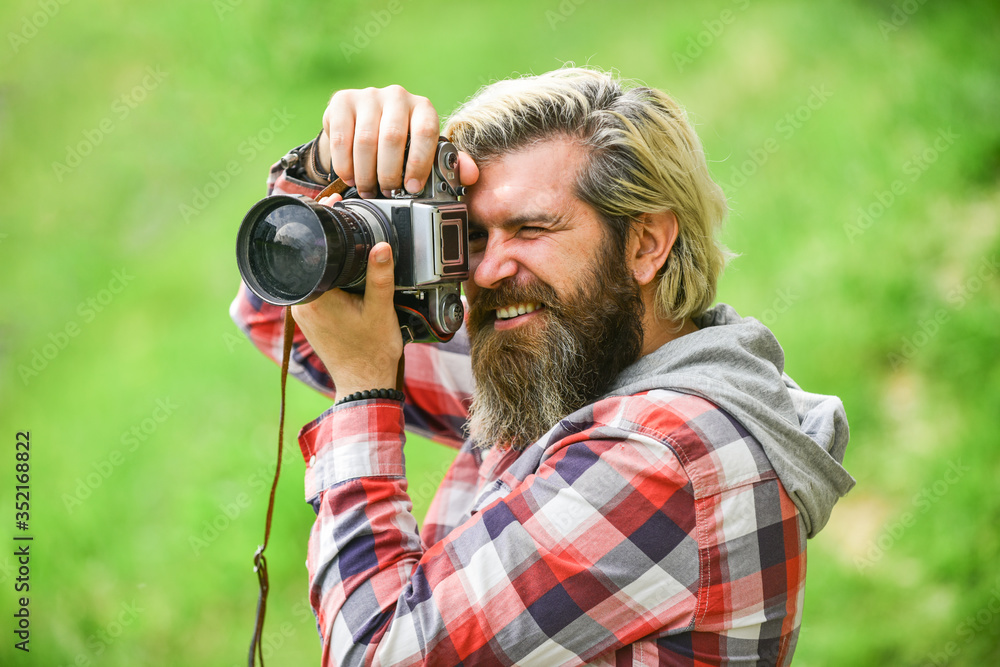 Enjoying hot day. bearded man hipster take photo. photo shooting outdoor. brutal man traveler with retro camera. photography in modern life. travel tips. professional photographer use vintage camera Enjoying hot day. bearded man hipster take photo. photo shooting outdoor. brutal man traveler with retro camera. photography in modern life. travel tips. professional photographer use vintage camera