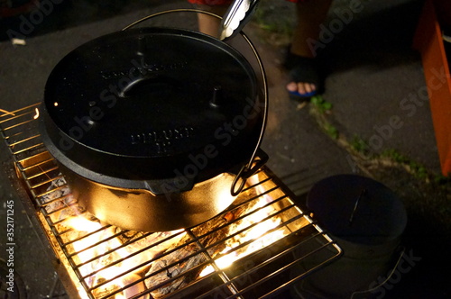 Cooking with Dutch Oven at Camp photo