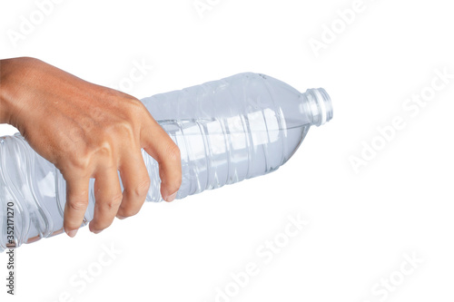 Hand holding water bottle isolated on white background. © nuruddean