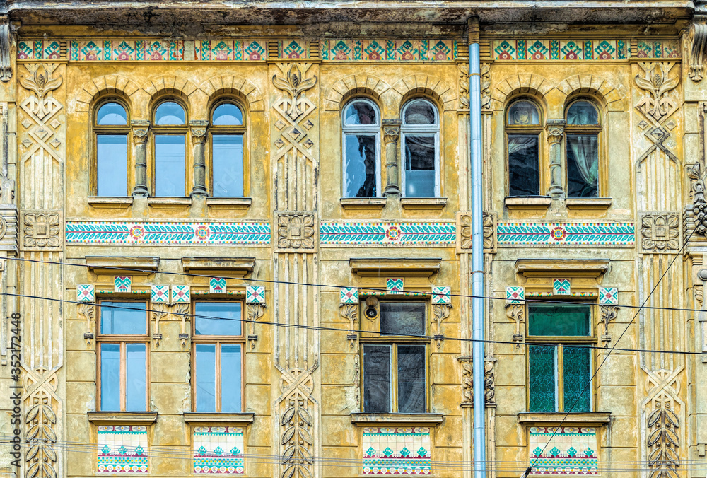 Beautiful facade of an old residential building in the historic quarter of the old city. Streets of Lviv