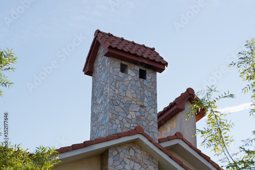 Roof element of a mansion with a chimney