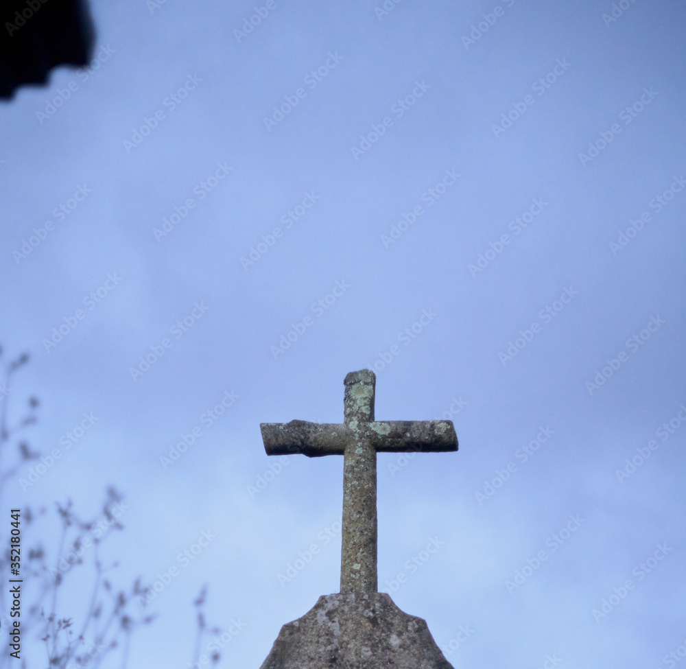 catholic cross on blue background