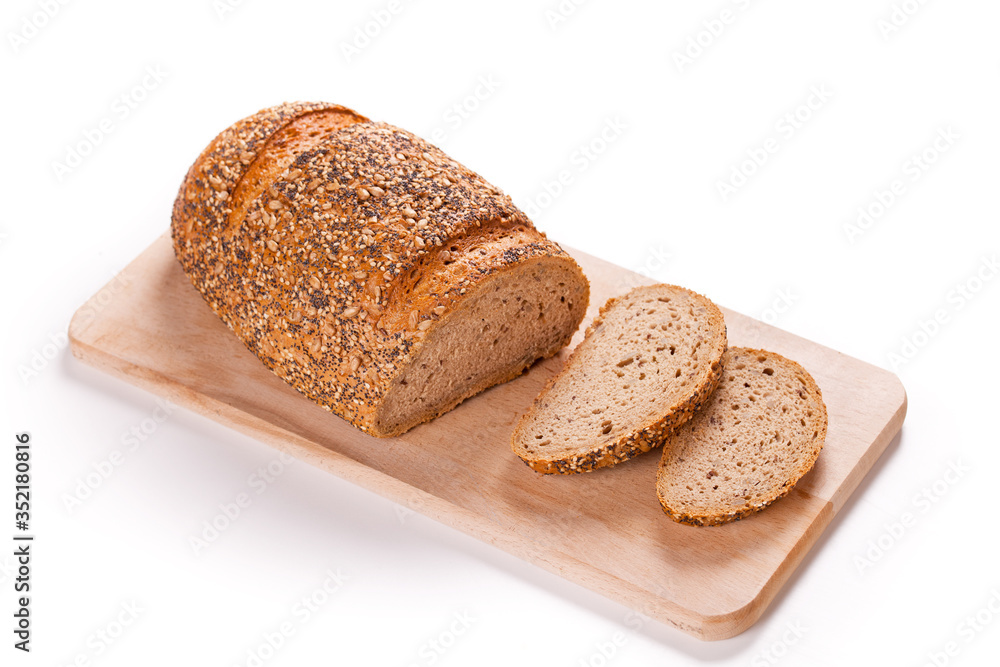 Sliced Loaf Of Bread On A Cutting Board Sliced Loaf Of Bread On A Cutting Board