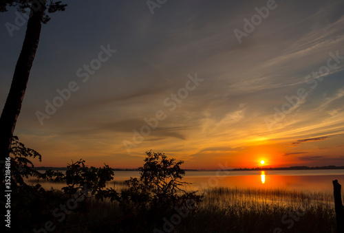 Summer lake at dawn, nature background.