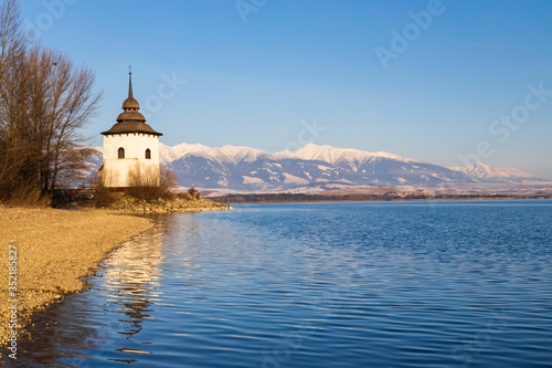 Church of Virgin Mary in Havranok and lake Liptovska Mara, district Liptovsky...