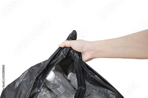 Hand woman holding a Garbage bag(Waste recycling) on white background with clipping path. © NewSaetiew