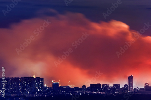 Smoke and fire in residential area in Moscow city at night © Андрей Журавлев