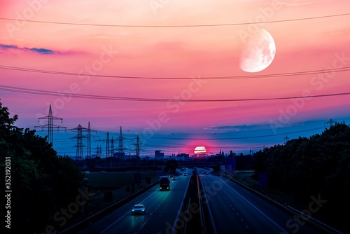 Obraz na płótnie Sunset, moving cars with light turned on. Night scene on the highway w salonie