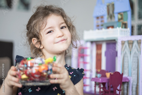 child girl plating with toys
