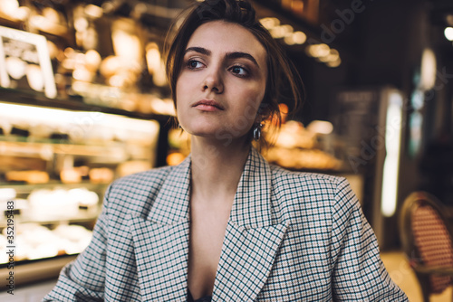 Serious formally dressed woman sitting in cafe © GalakticDreamer
