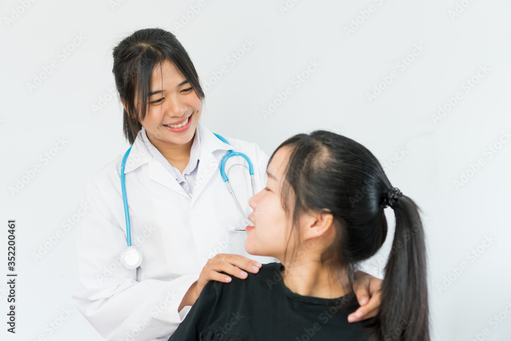 Young Asian female doctor hand holding hands of teen patient when her serious about heartache, depression, heartbroken for comforting for peace of mind, Medicine student treatment in hospital concepts Young Asian female doctor hand holding hands of teen patient when her serious about heartache, depression, heartbroken for comforting for peace of mind, Medicine student treatment in hospital concepts