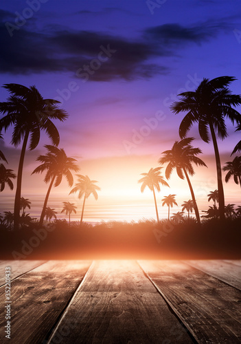 Sea evening landscape with sunset. Palm tree branches, silhouettes, sunlight. Wooden table by the sea. Night view, open-air seascape. 3D illustration