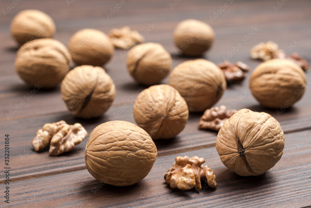 Closeup walnuts on dark wooden background. Closeup walnuts on dark wooden background.