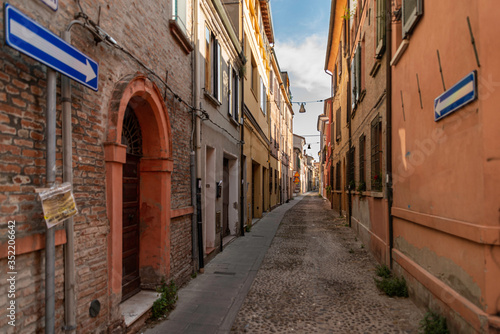 Fototapeta Naklejka Na Ścianę i Meble -  Cozy narrow street in Ferrara, Emilia-Romagna, Italy.
