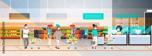 customers in protective masks with groceries keeping distance to prevent coronavirus pandemic standing line queue to female cashier grocery shop interior horizontal full length vector illustration
