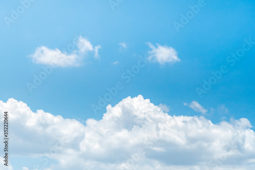 Blue sky background with clouds. © aedkafl