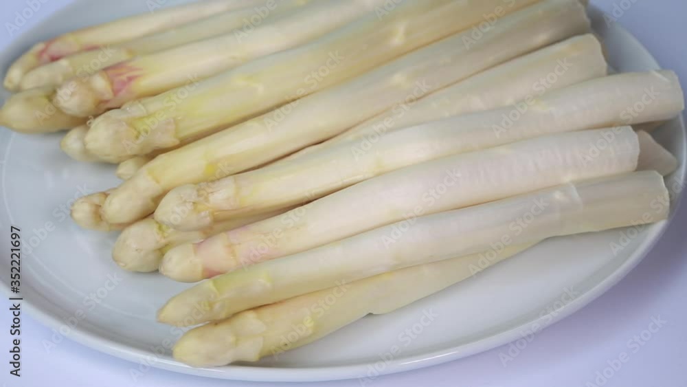 close-up of asparagus on a white rotating plate
close-up of asparagus on a white rotating plate