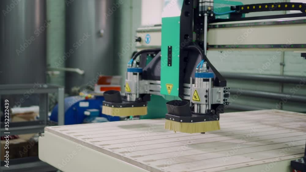 Elements of the CNC machine move during program execution. Close-up. Elements of the CNC machine move during program execution. Close-up.