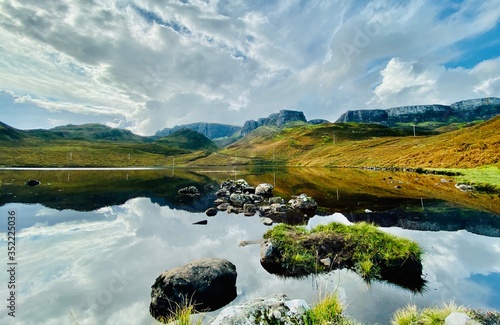 Isle of Skye mountain landscape with blue sky and lake © Gavin