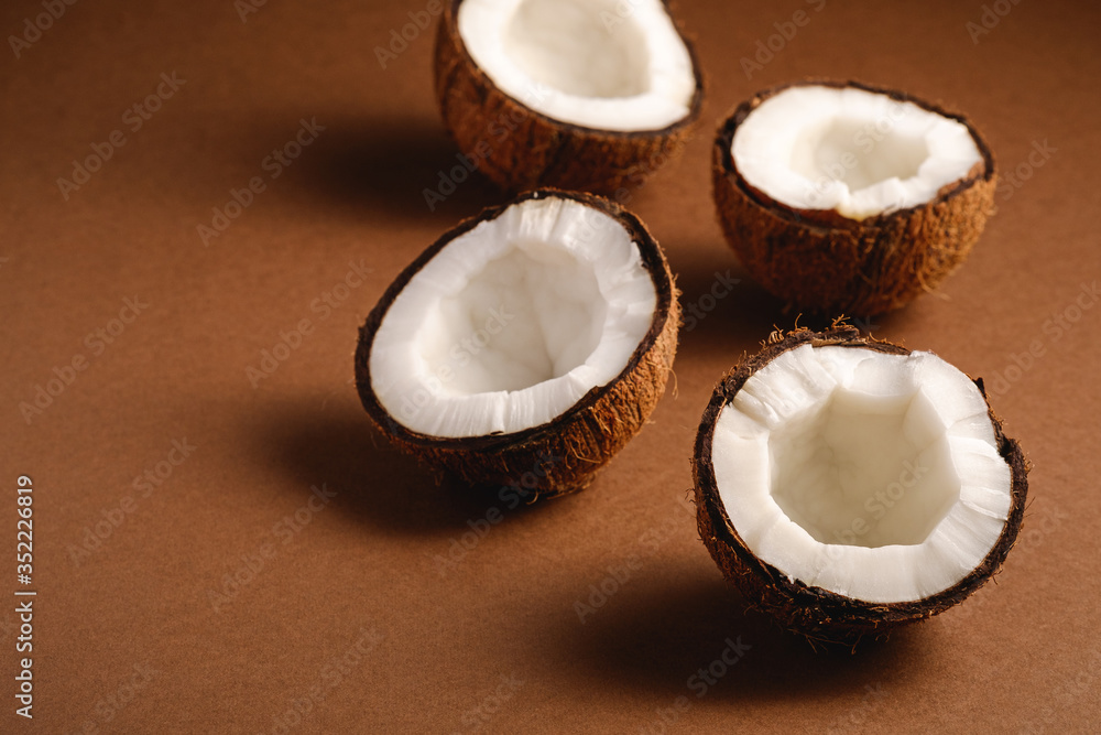 Coconut fruits on brown plain background, abstract food tropical concept, angle view copy space Coconut fruits on brown plain background, abstract food tropical concept, angle view copy space