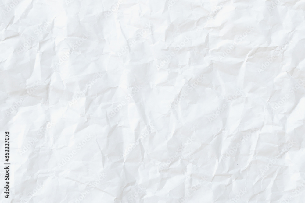 Naklejka premium Modern crumpled white paper on empty sheet gray background with light shadows for creative wallpaper, card, art work design.