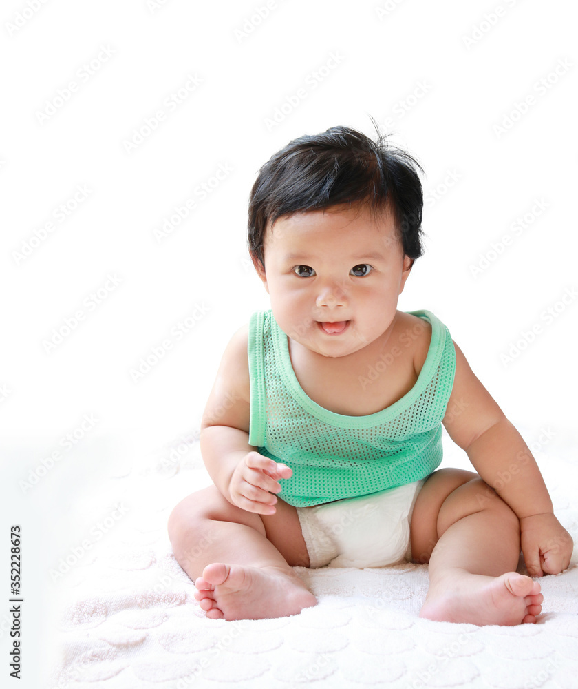 A Baby girl in the light blue dress Laughing happily and looking directly A Baby girl in the light blue dress Laughing happily and looking directly