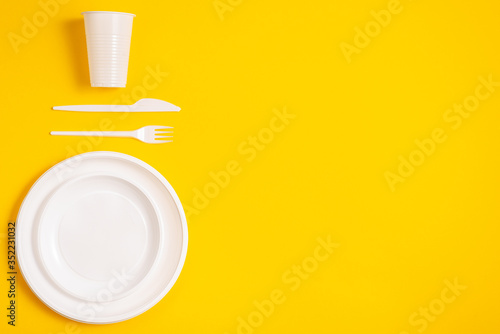 plastic spoon on a yellow background