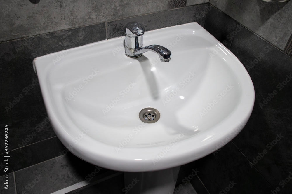 White washbasin in a restaurant. 25 May 2020. Minsk, Belarus White washbasin in a restaurant. 25 May 2020. Minsk, Belarus