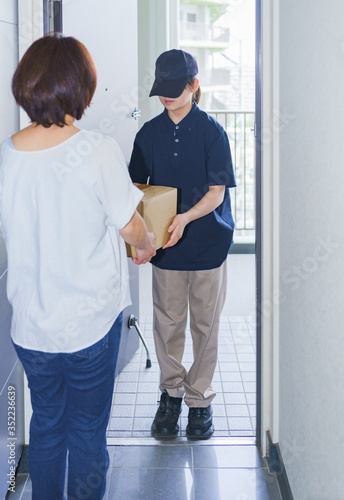 delivery person and cardboard box