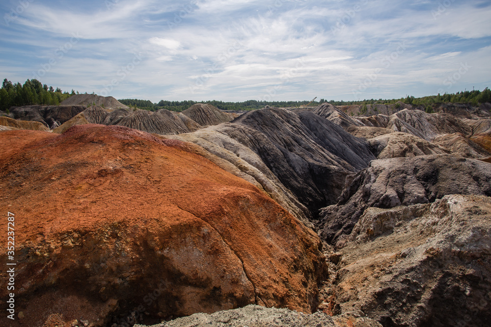 Obraz premium Amazing kaolin clay marsian landscape quarry open pit at summer day
